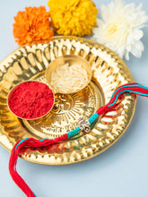 Divine Silver Ganesha Rakhi with Red & Blue Thread