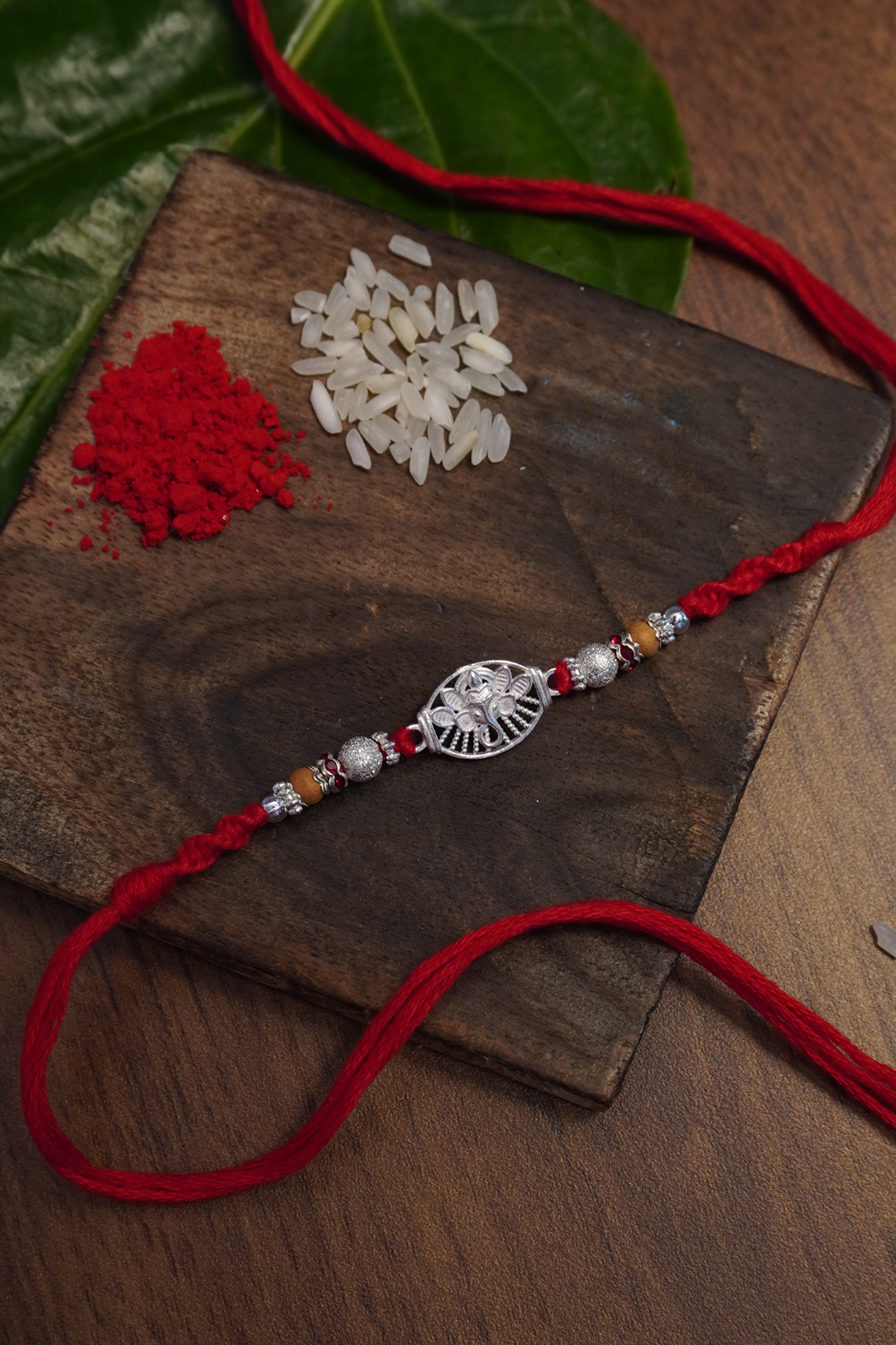 Sterling Silver Designer Ganesha Dome & Om Combo Rakhi - Designer Rakhi Online