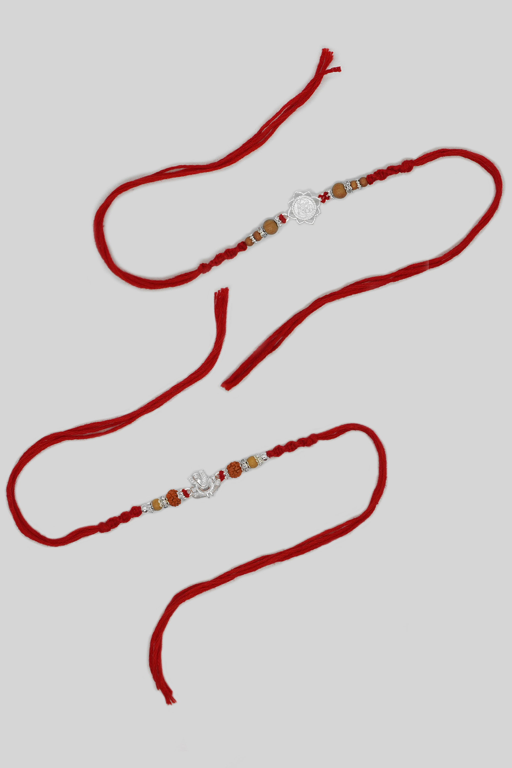 Combo OM & Ganesh Rakhi with Rudraksh Chandan Beads - Silver Rakhi Design