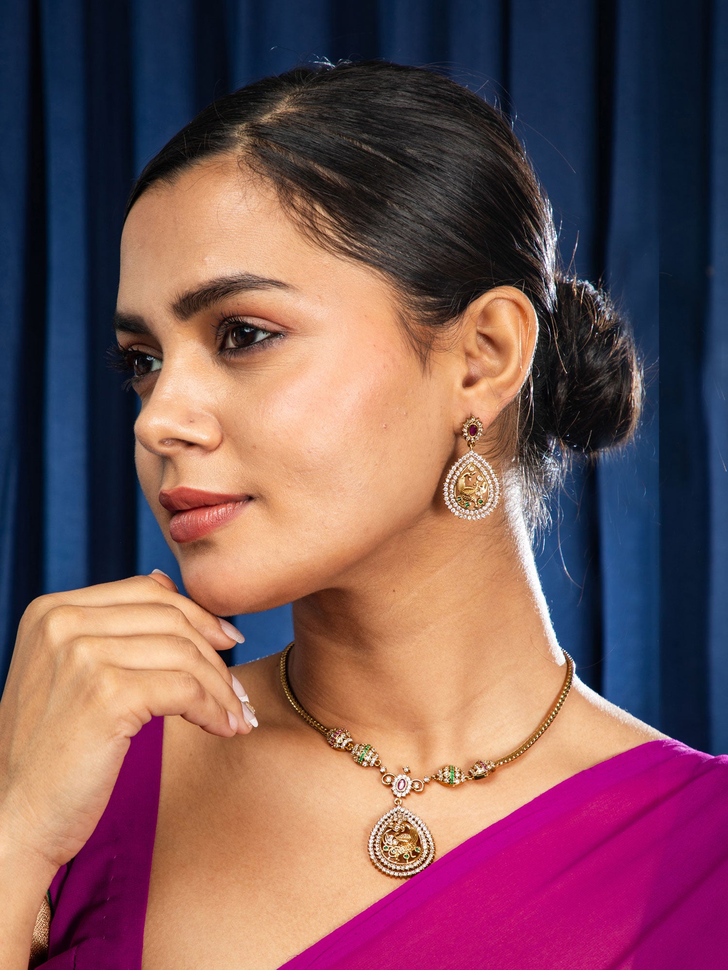 Women wearing bridal temple jewellery necklace set with gold polish and kundan stones