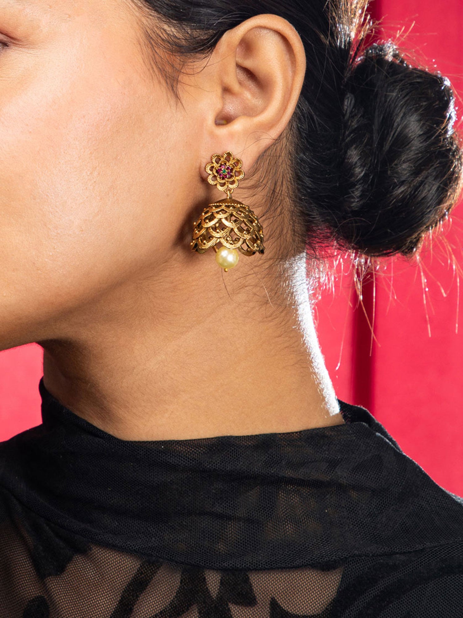 Women wearing elegant gold plated jhumka earrings for women