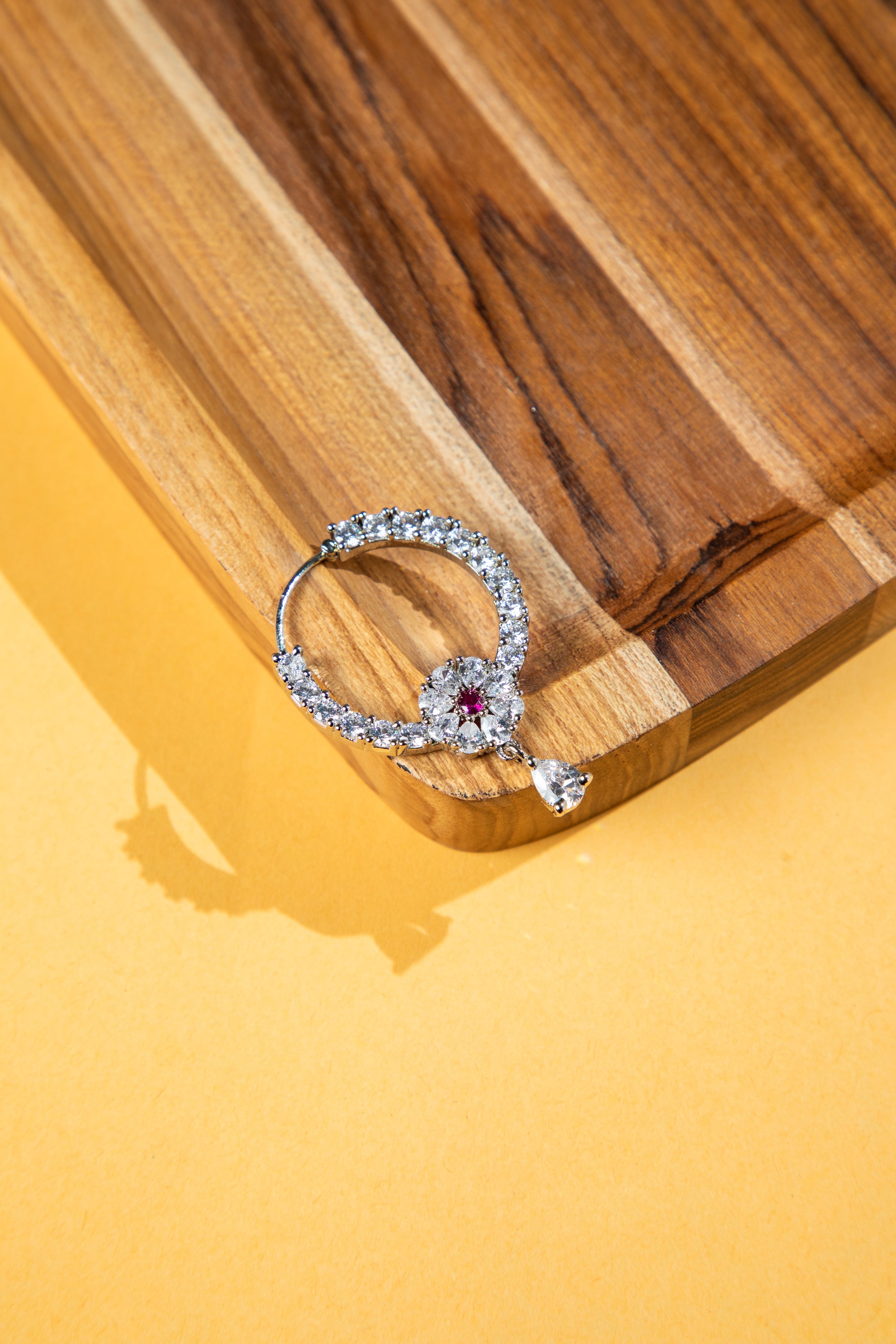 Modern stone studded nose rings for women in silver finish, lightweight daily wear.