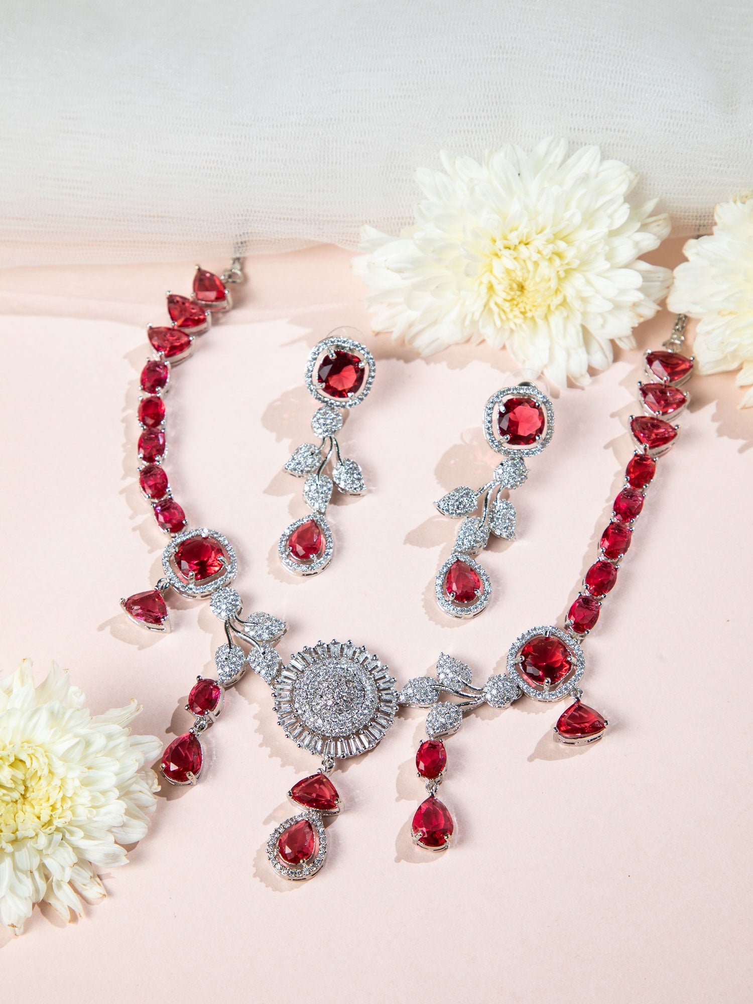 Designer red stone necklace set with silver detailing and floral design