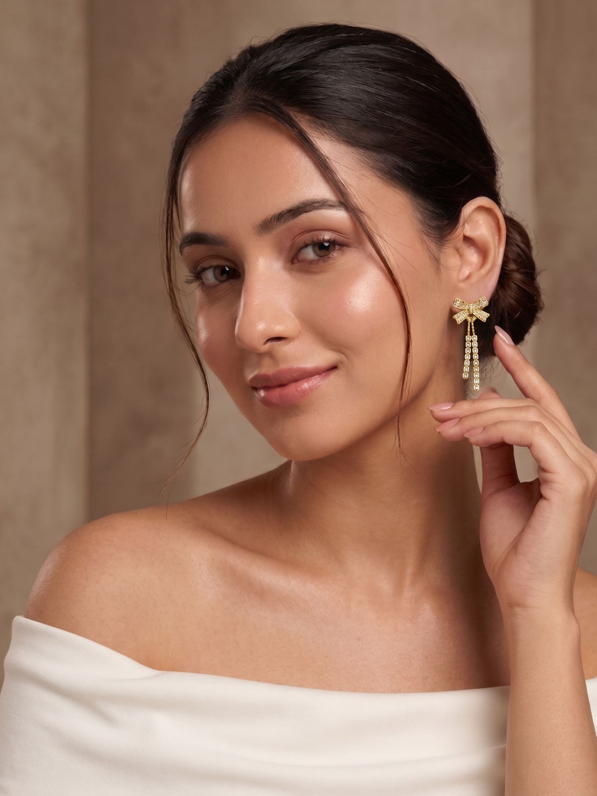 Gold Plated Bow Design White Stone Dangler Earrings