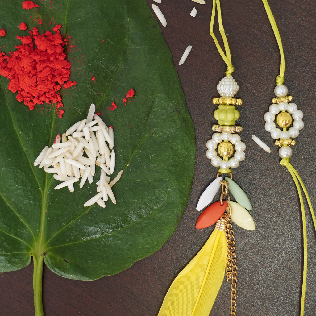 Handcrafted Couple Rakhi with Pearl by Niscka - Rakhi Design